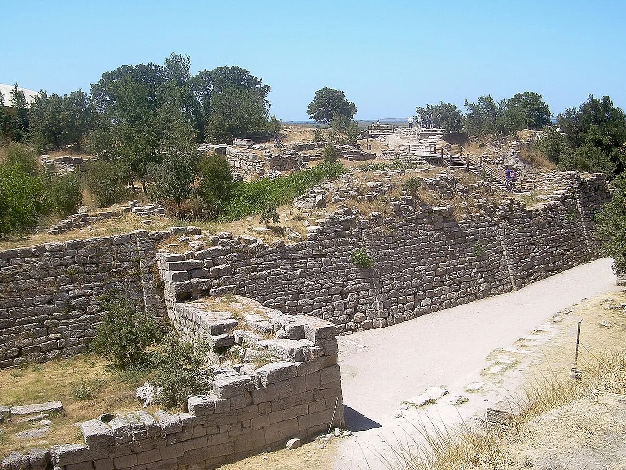 Excavated stone walls and ramps on the mound of Troy